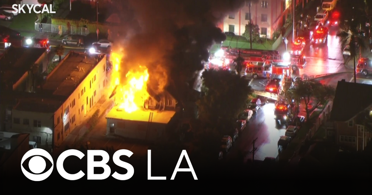 Los Angeles firefighters battling large fire at Arlington Heights home