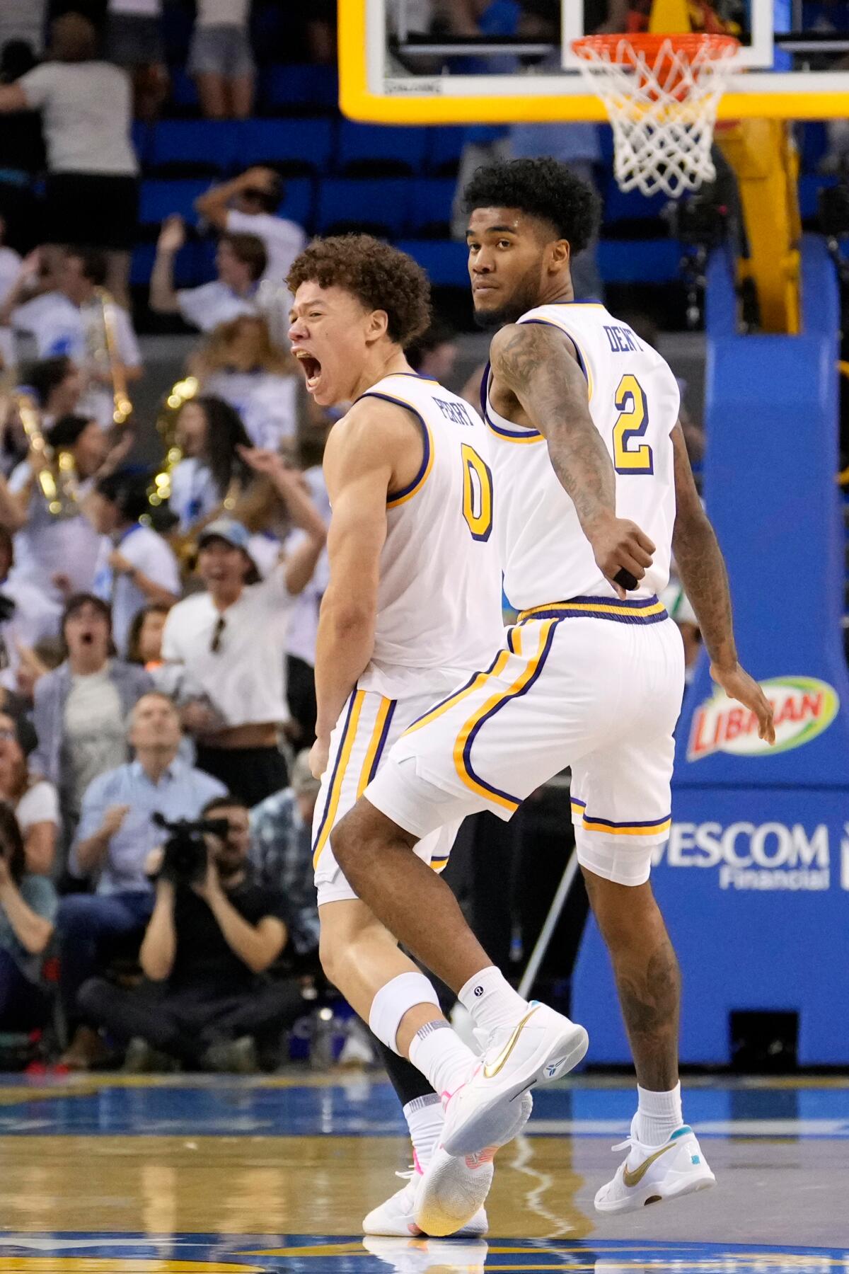 UCLA guard Trent Perry celebrates his tying three against Indiana. He led the Bruins with 25 points.