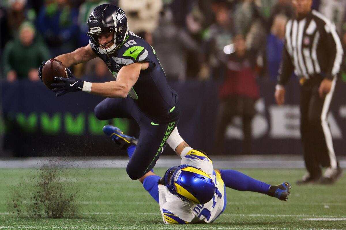 Seahawks wide receiver Cooper Kupp is tackled by Rams cornerback Cobie Durant.