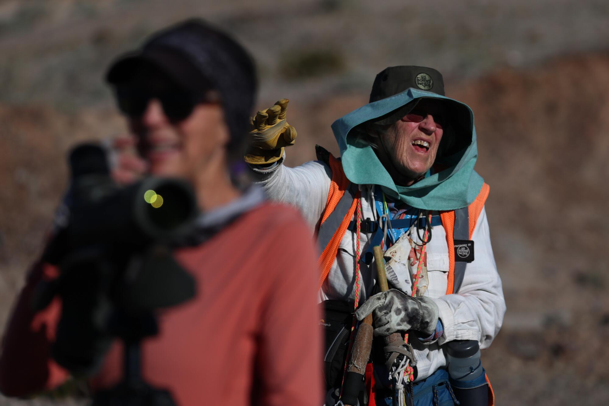 Edie Harmon documented the concertina wire being strung over the rugged landscape.