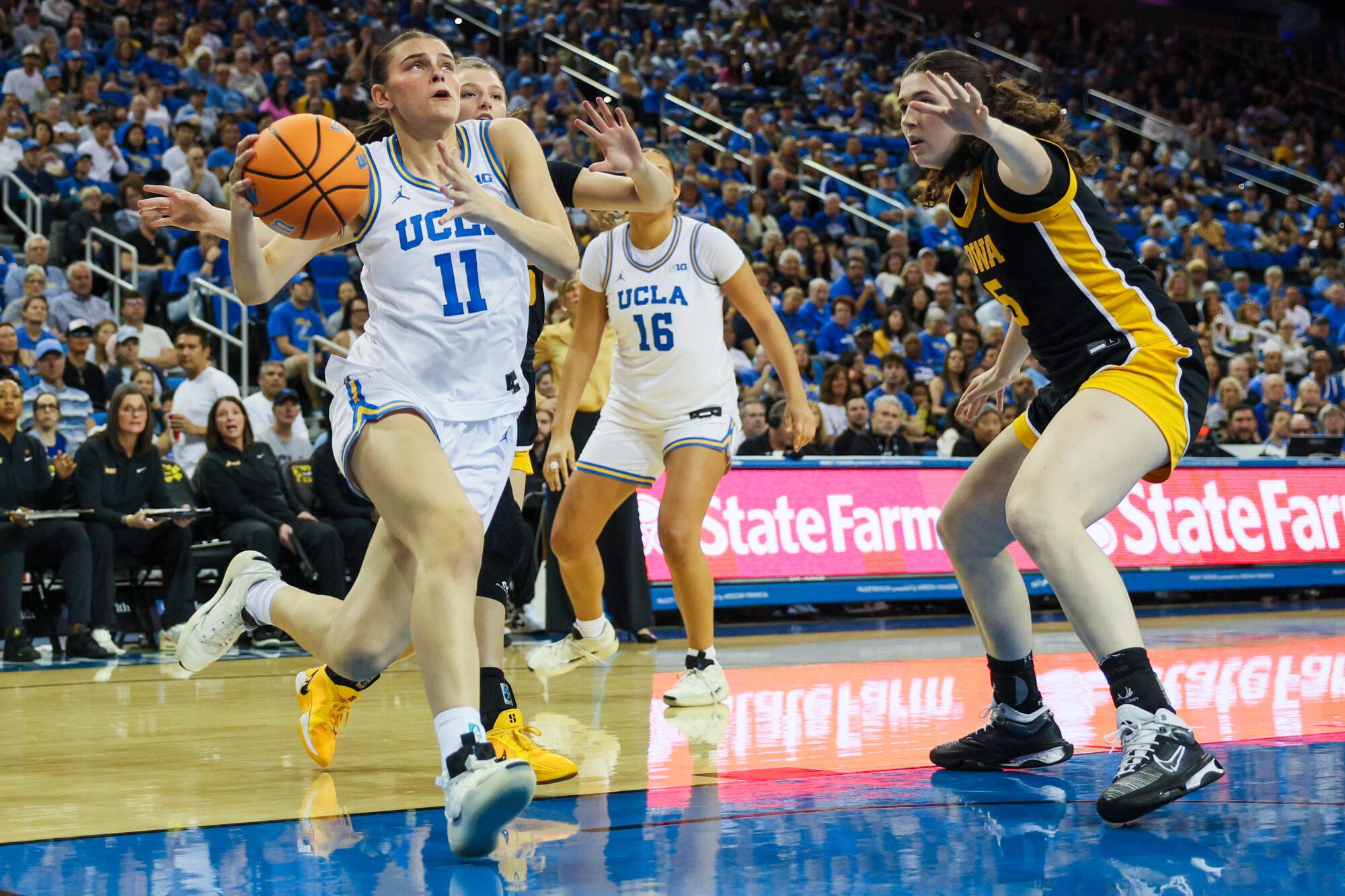UCLA guard Gabriela Jaquez drives to the basket against Iowa in the first half.