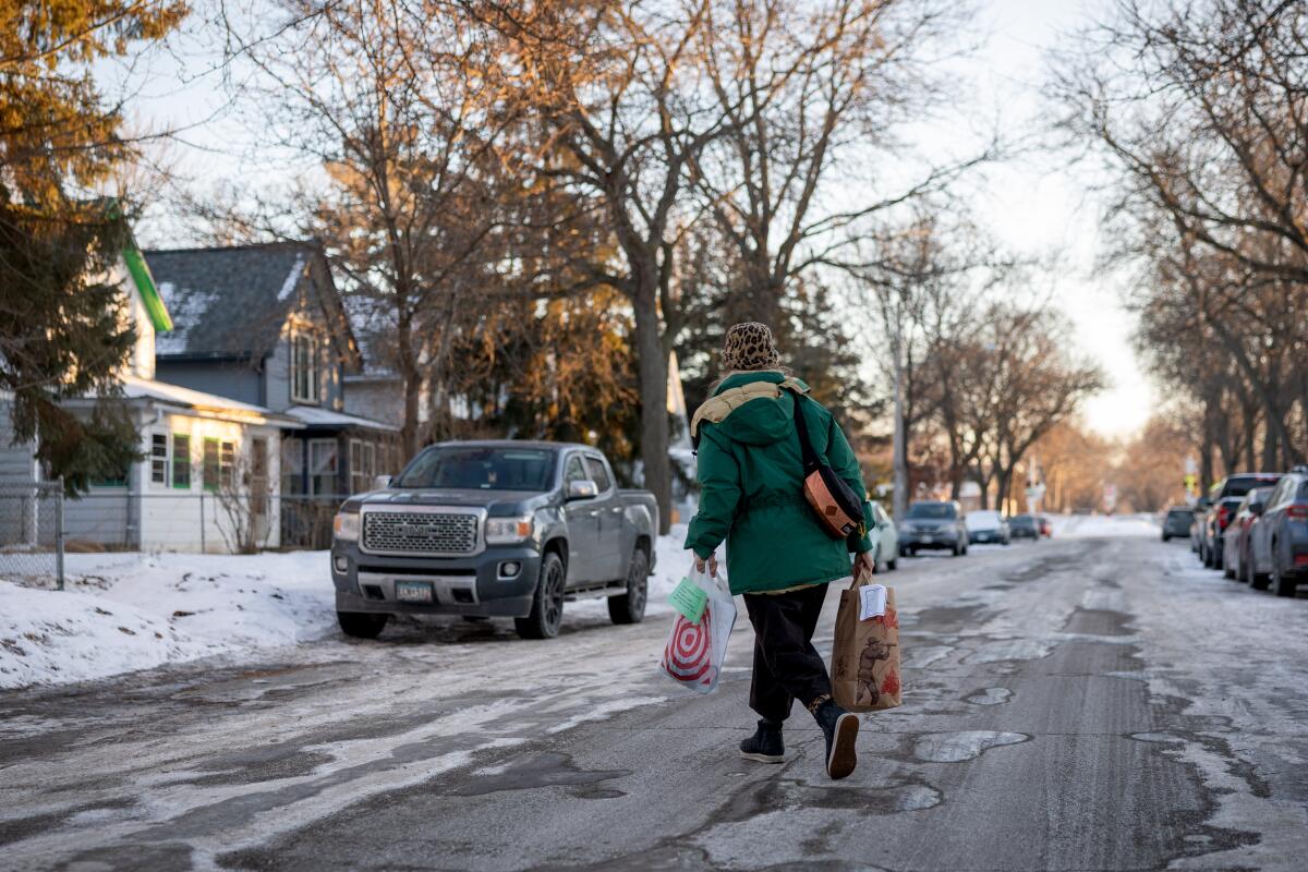a teacher makes a delivery to a family