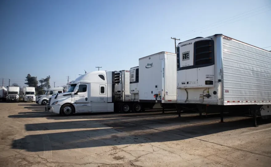 A row of semi-trucks and trailers at the Gillson Trucking Inc. facility in Stockton on Jan. 16, 2026.