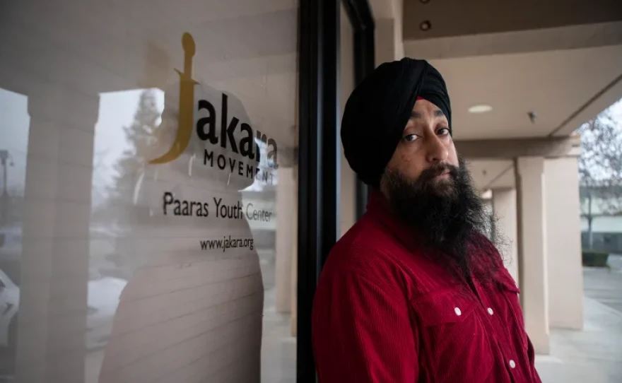 Naindeep Singh, executive director of Jakara Movement, stands next to the front entrance of the Jakara Movement Paaras Youth Center in Fresno on Jan. 16, 2026.
