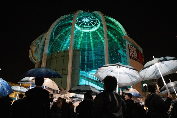 A general view of the Rotunda as participants march with umbrellas printed with aerial photographs at City Hall in San Jose, Calif., on Saturday, Jan. 31, 2026. (Thien-An Truong for Bay Area News Group)