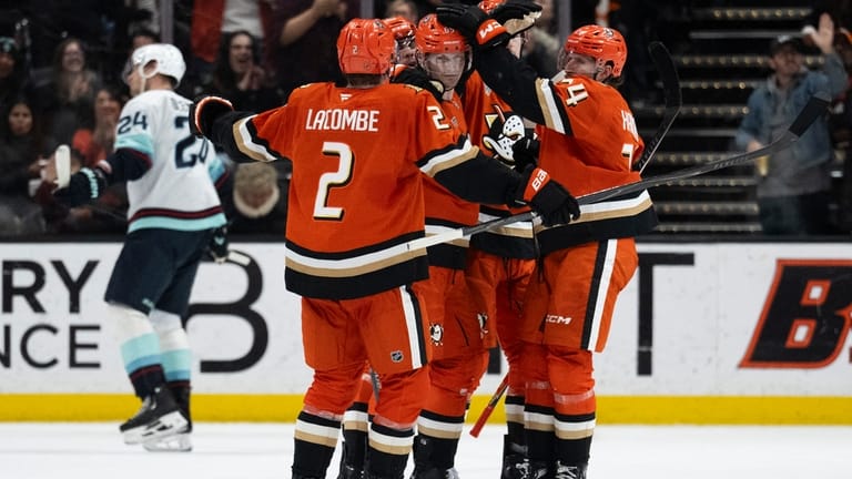 Anaheim Ducks defenseman Jacob Trouba (65) celebrates his goal with...