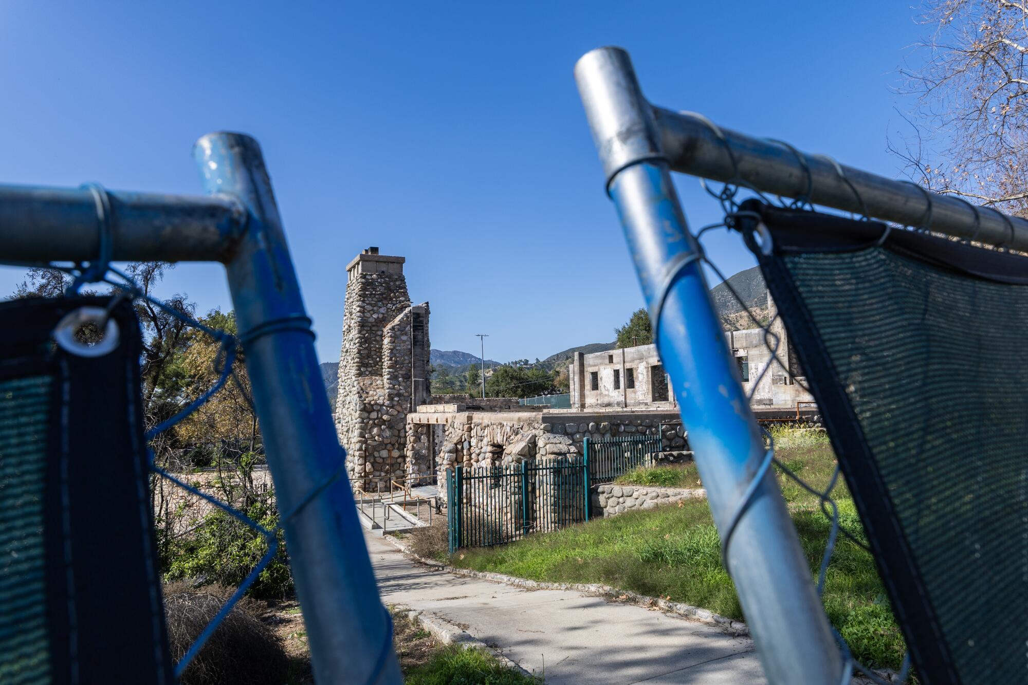 A view of a closed park through a gate.