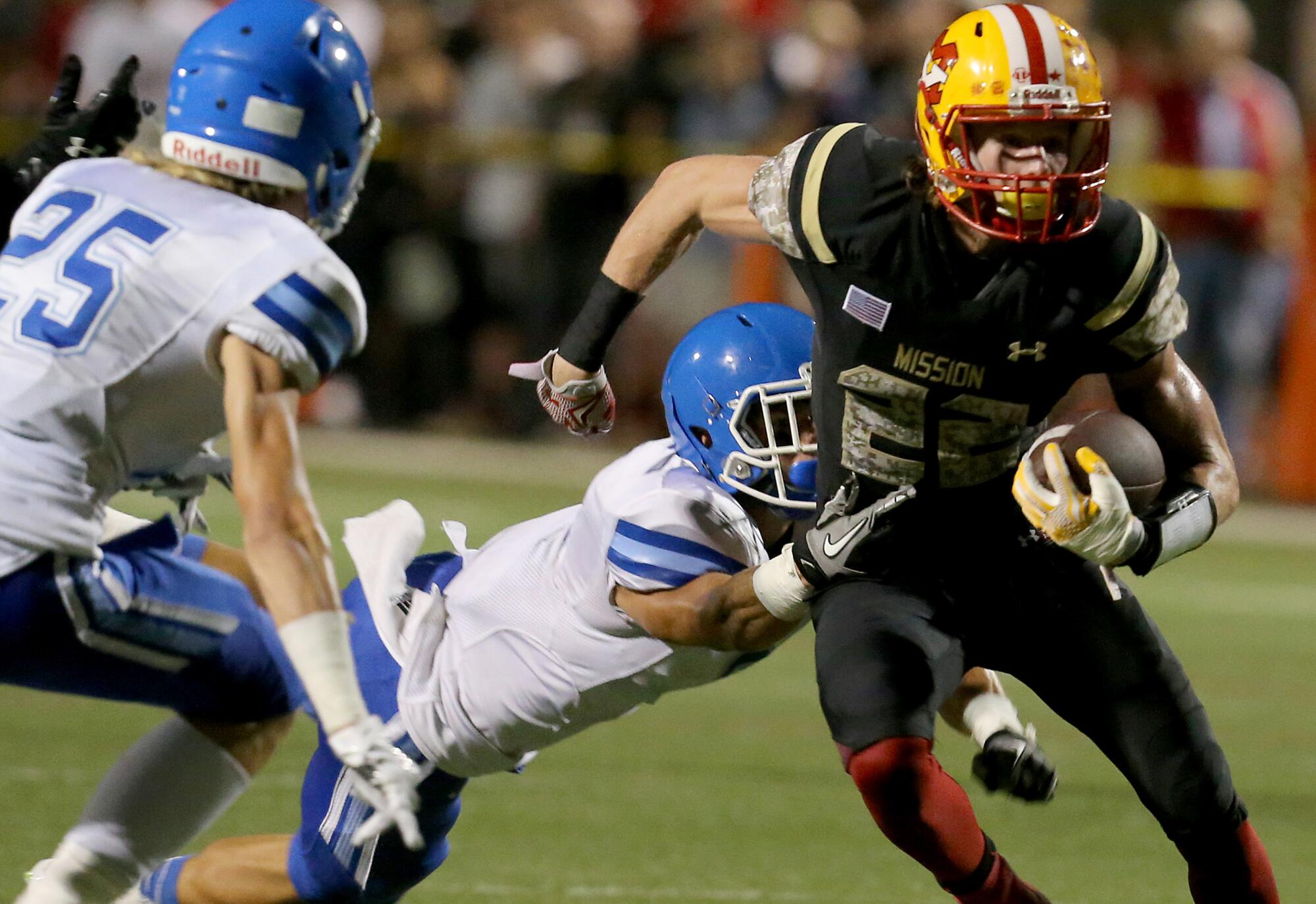 Mission Viejo wide receiver Brenden Schooler looks for room to run against Norco in 2015.