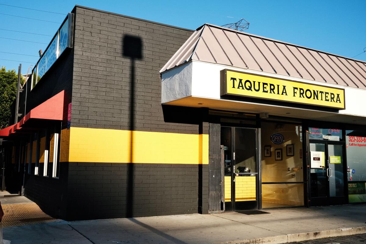 An exterior of the black-and-yellow Taqueria Frontera in Silver Lake.