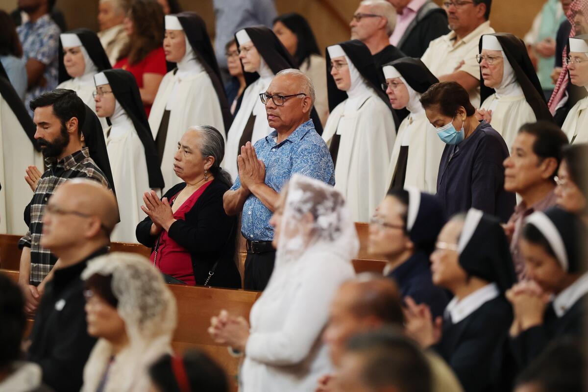 Parishioners and members of the Catholic Church