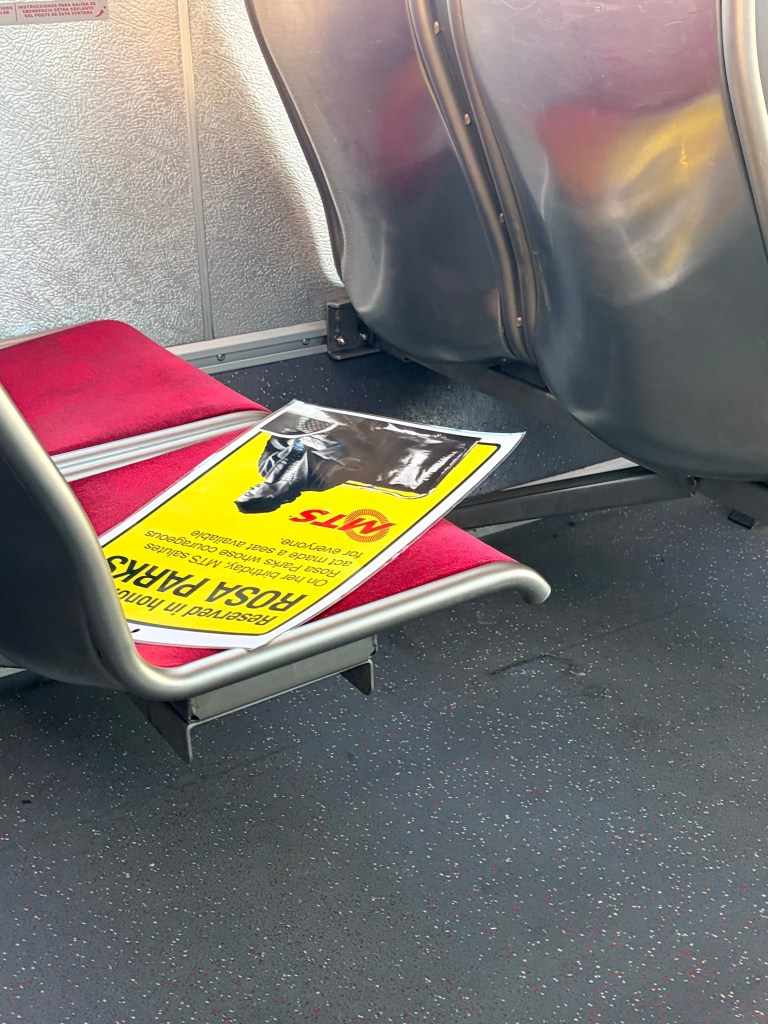 MTS sign reserving a seat for Rosa Parks Day.  (Photo by Adrian Childress/Times of San Diego)