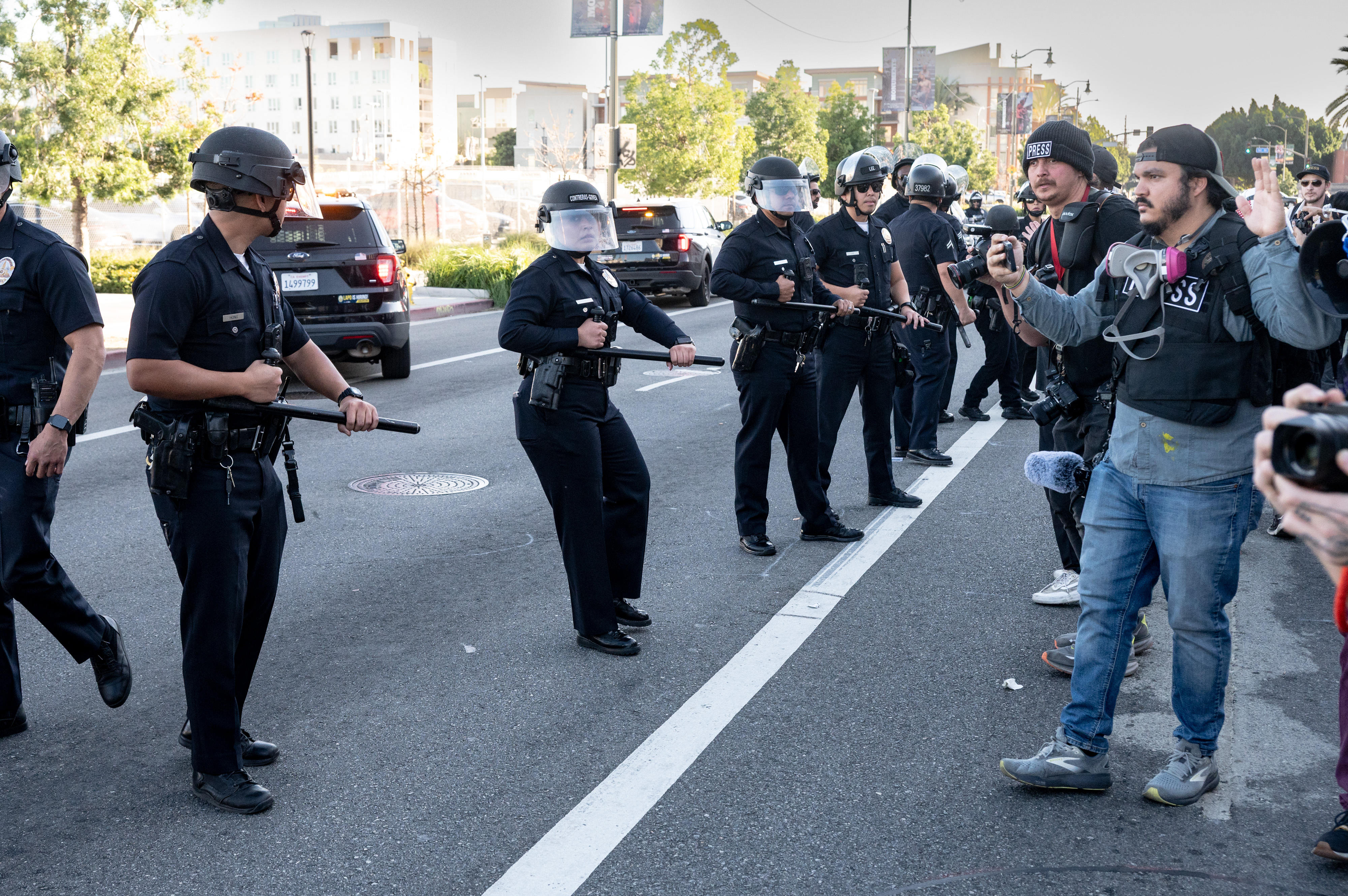 LAPD officers issue a disperse order to small group of...
