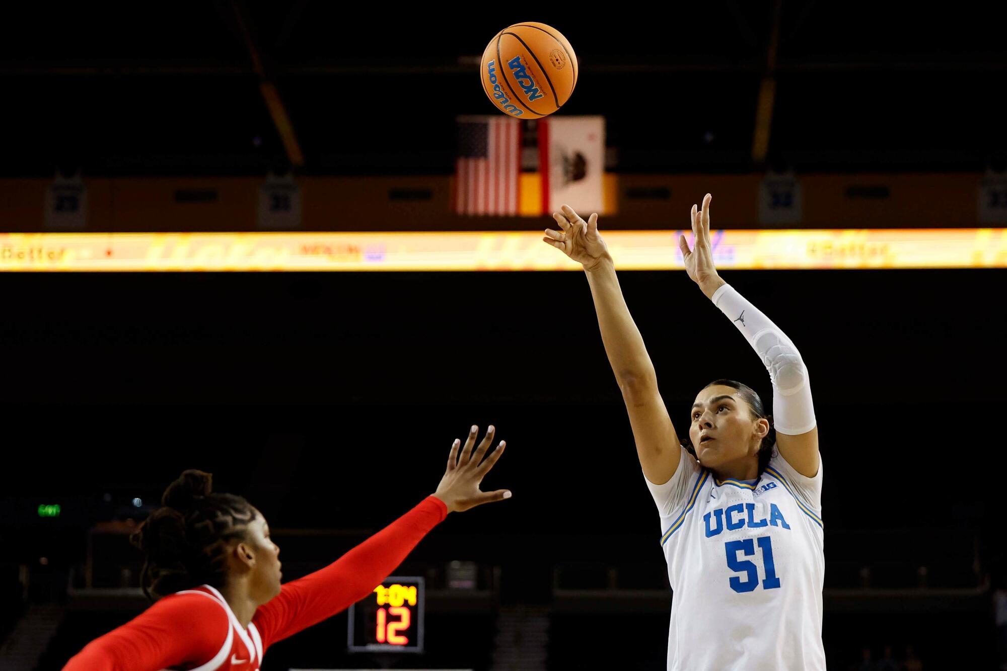 UCLA center Lauren Betts shoots while being guarded by Rutgers' Kaylah Ivey Wednesday at Pauley Pavilion.