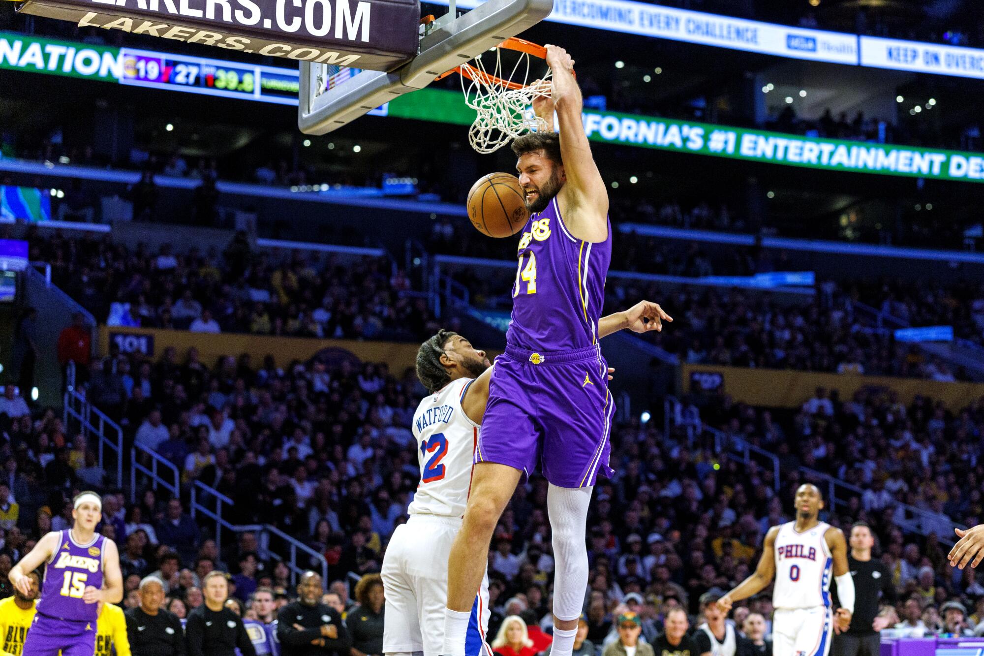 Lakers forward Maxi Kleber dunks in front of 76ers forward Trendon Watford at Crypto.com on Thursday.