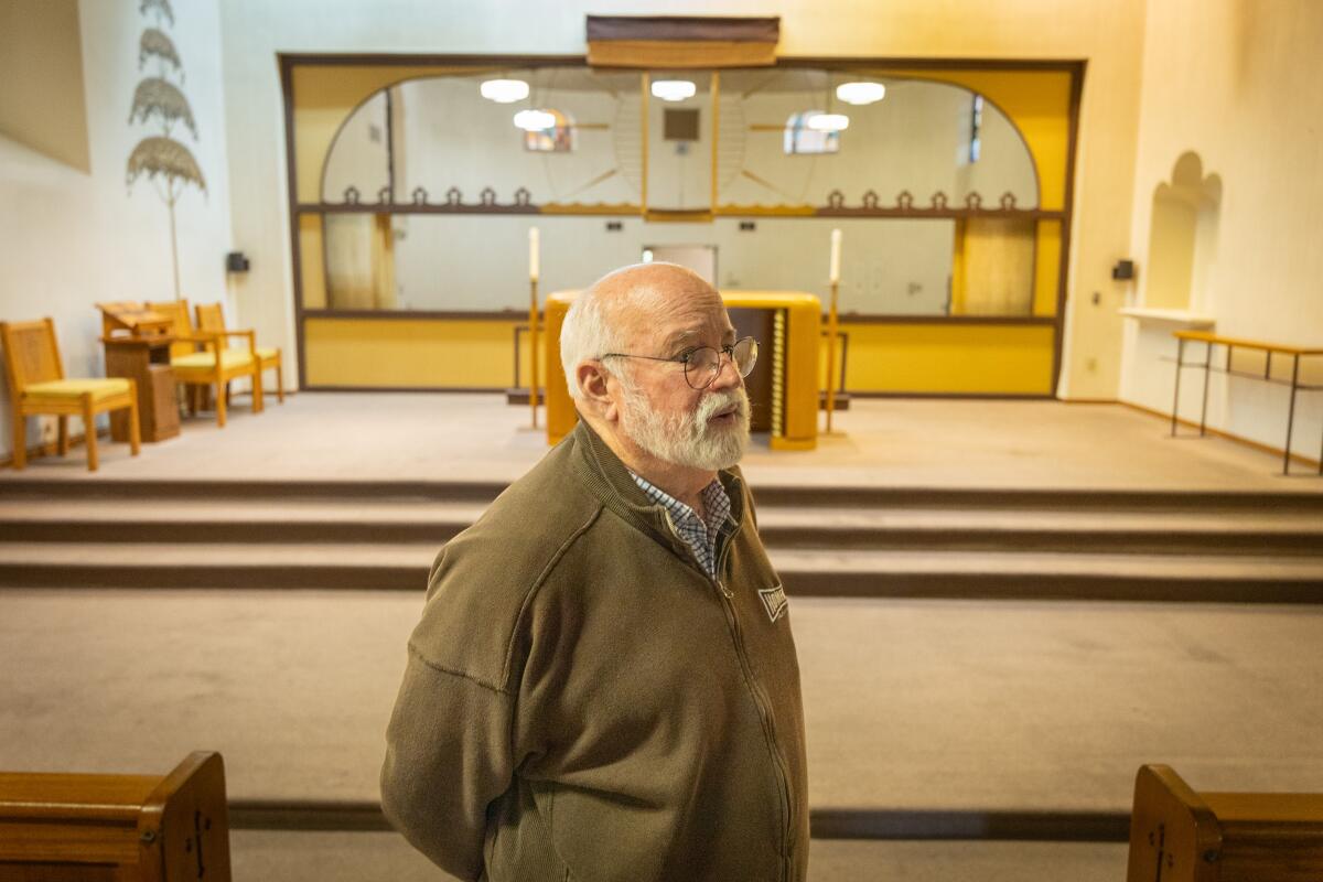 Father Greg Boyle, founder of Homeboy Industries, stands in the chapel at the Monastery of the Angels.