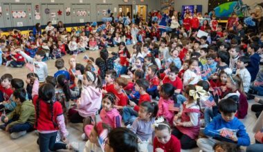 Students celebrate Long Beach's Charlie McAvoy competing in the Winter Olympics