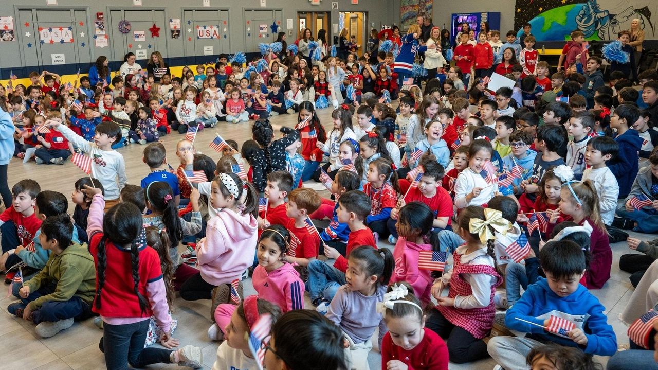 Students celebrate Long Beach's Charlie McAvoy competing in the Winter Olympics