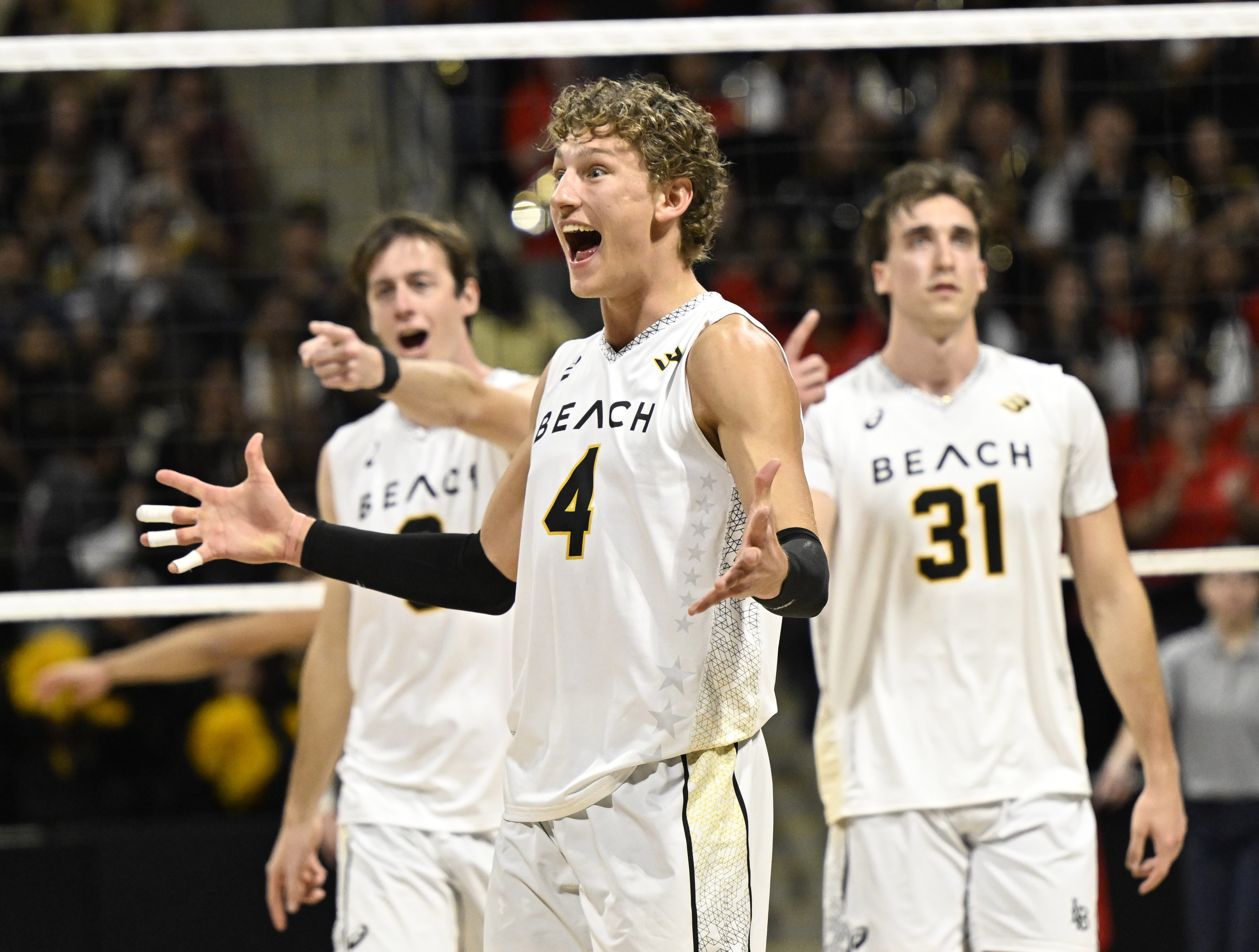 Long Beach State outside hitter Skyler Varga (4) celebrates after...
