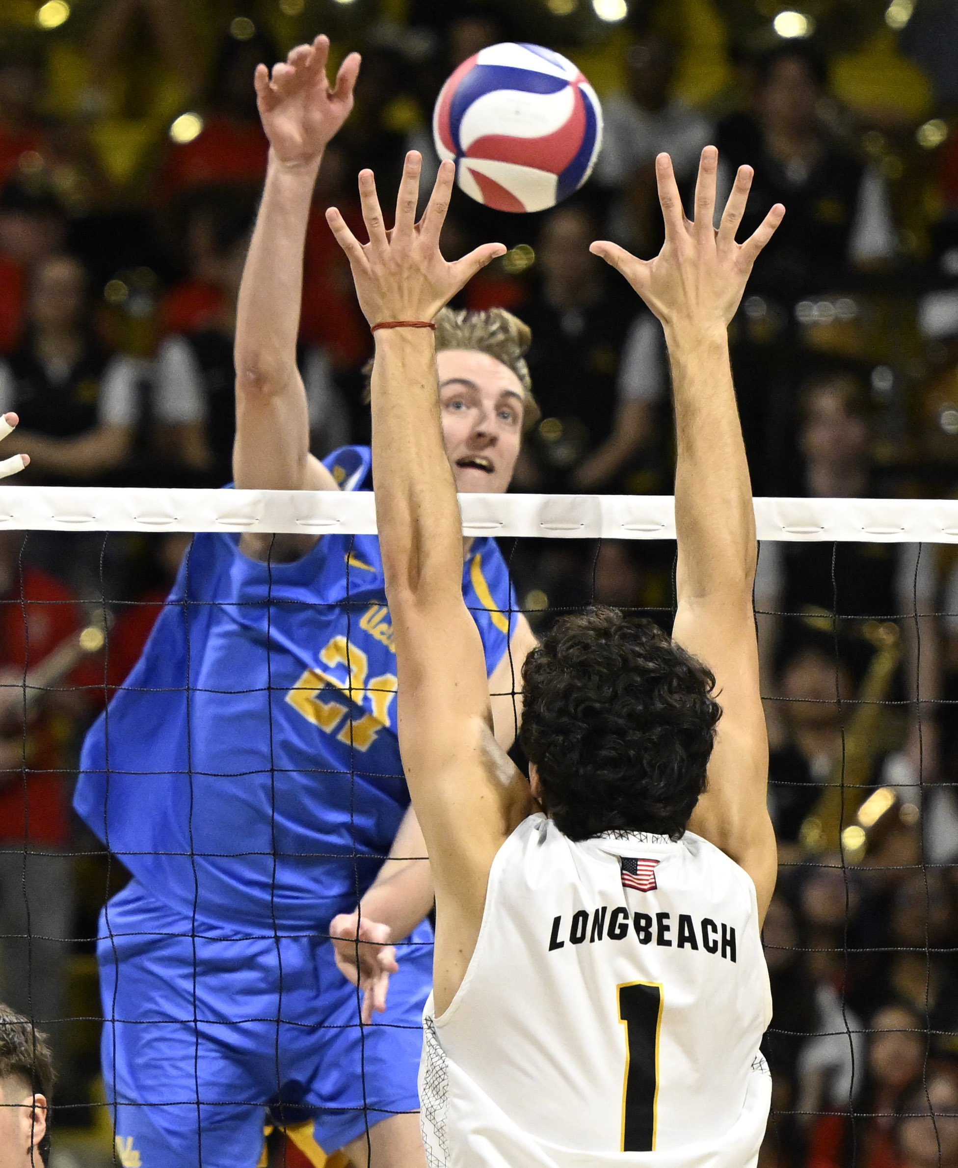 UCLA outside hitter Zach Rama (21) hits against Long Beach...