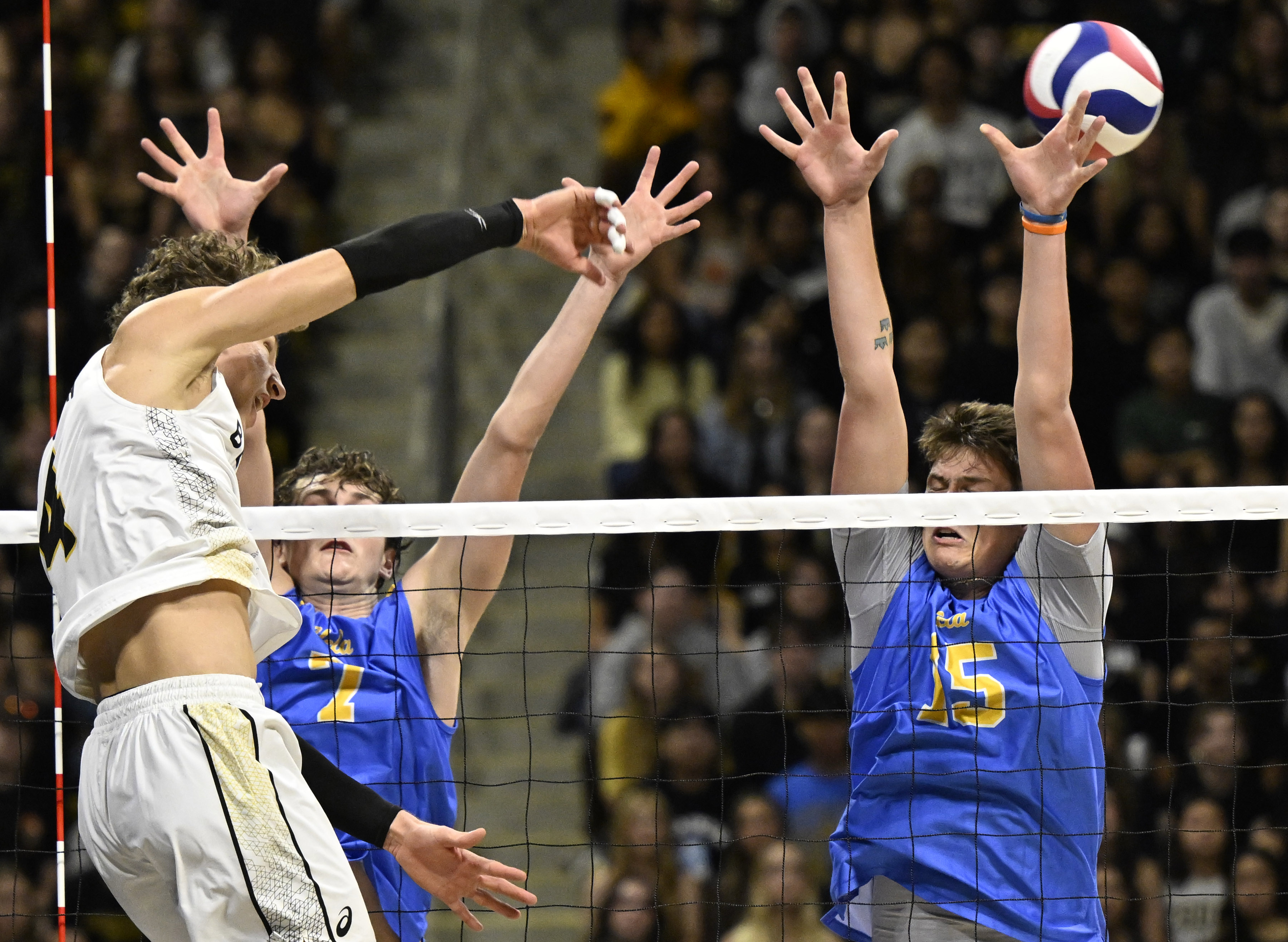 Long Beach State outside hitter Skyler Varga, left, scores past...