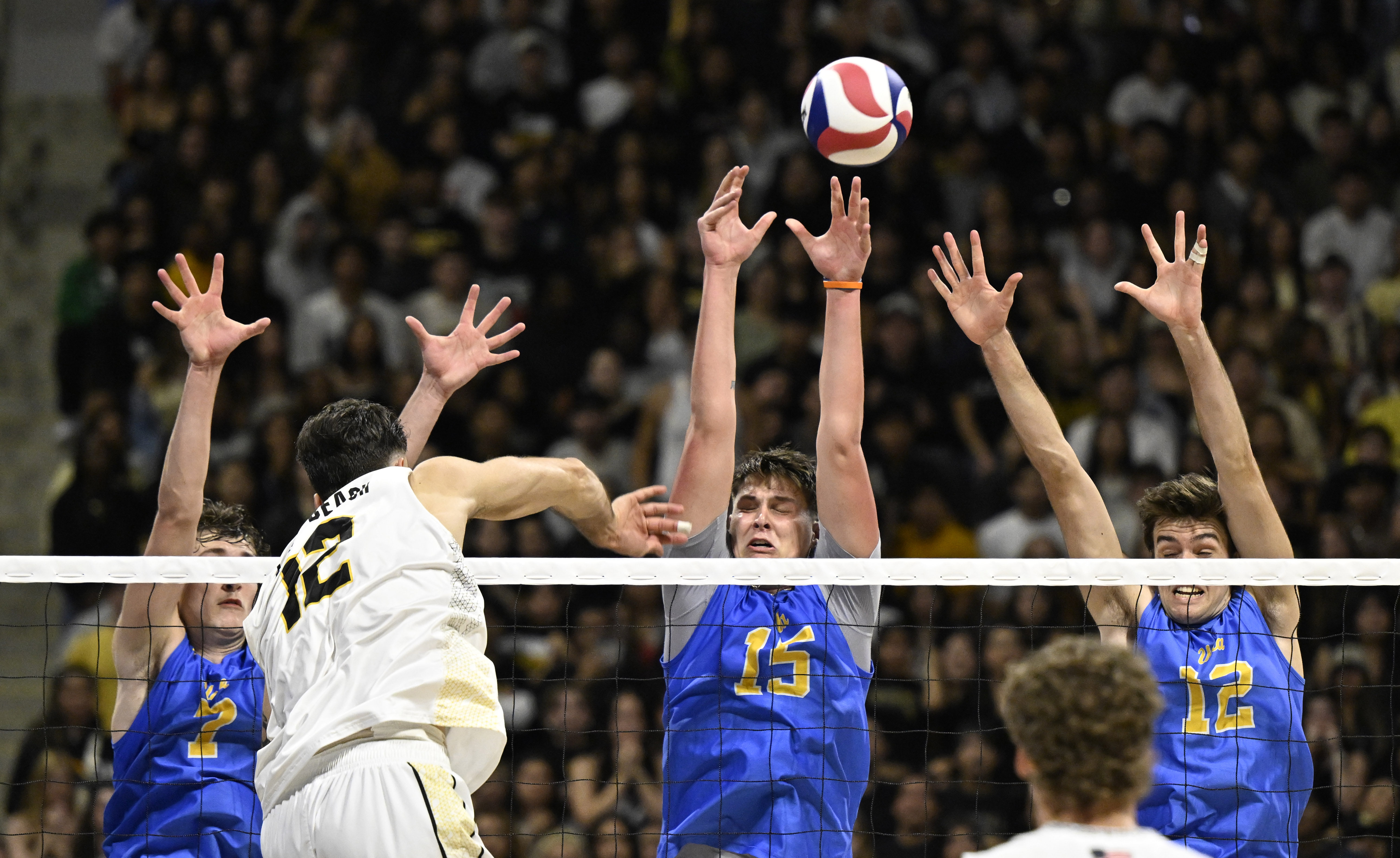Long Beach State outside hitter Alex Kandev (12) hits as...