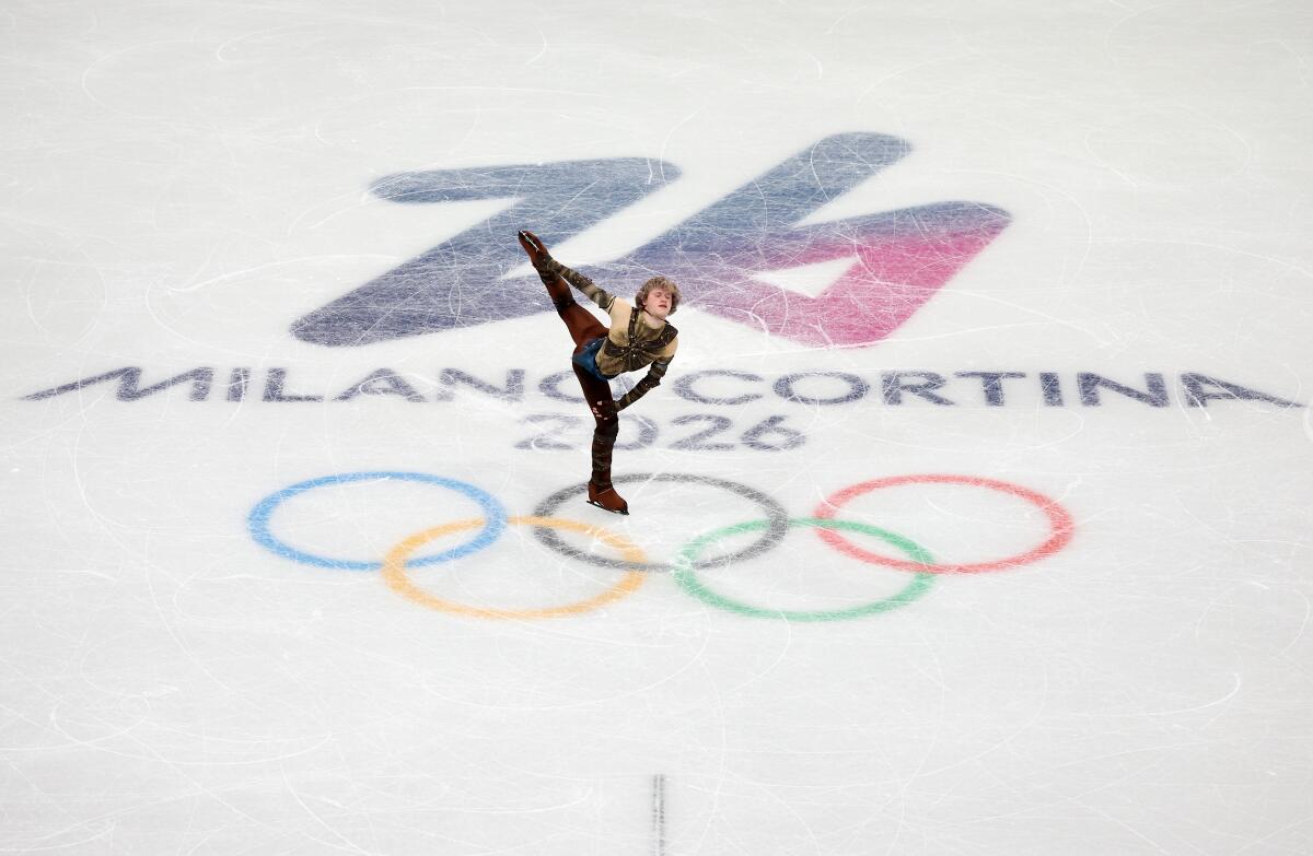 Ilia Malinin said he simply was managing his energy to prepare for the individual event, which begins Tuesday.