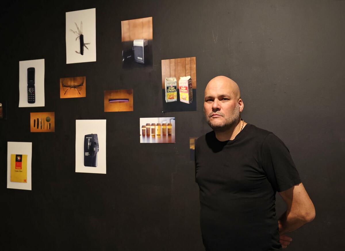 Artist Carlos Viani at his "Next of Kin" exhibition at the Grand Central Art Center in Santa Ana.
