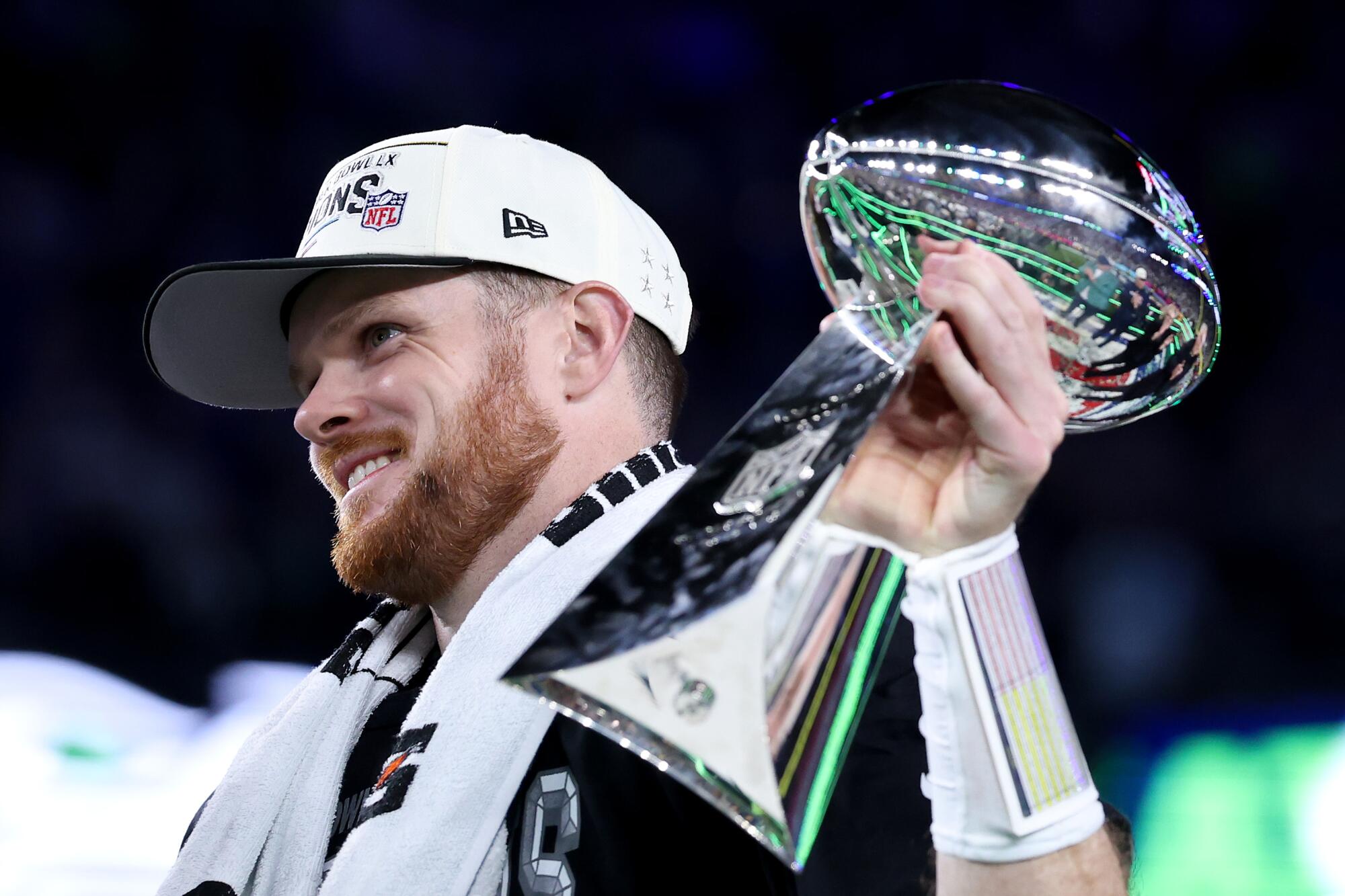Seahawks quarterback Sam Darnold celebrates while holding the Vince Lombardi Trophy following Seattle's 29-13 win.
