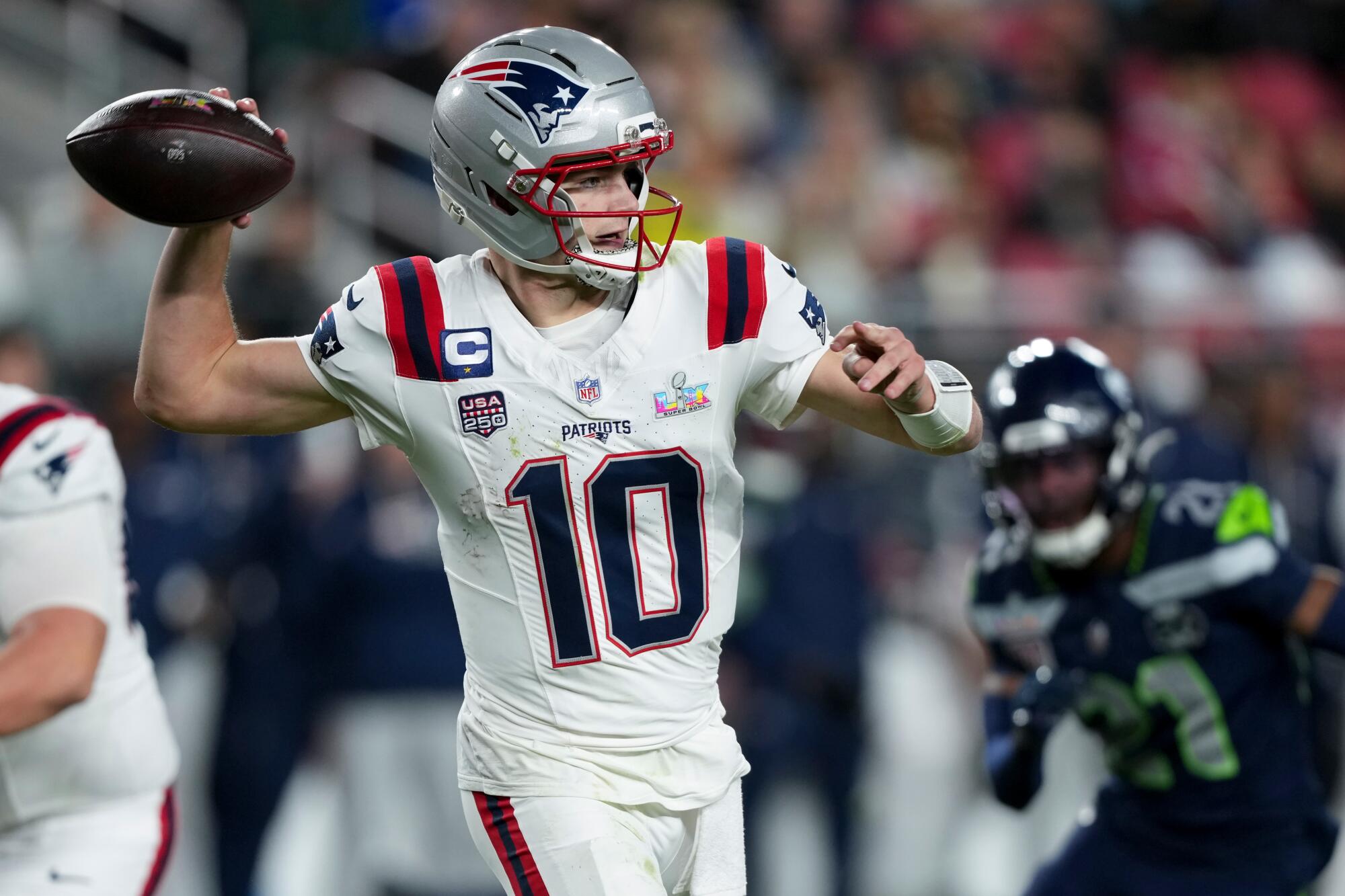 Patriots quarterback Drake Maye passes against the Seahawks.