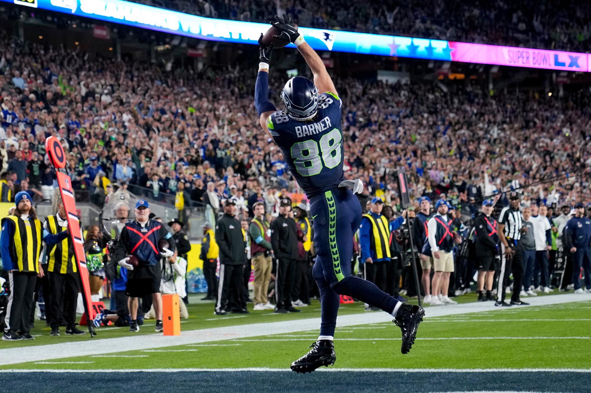 Seattle Seahawks tight end AJ Barner catches a touchdown pass against the New England Patriots.