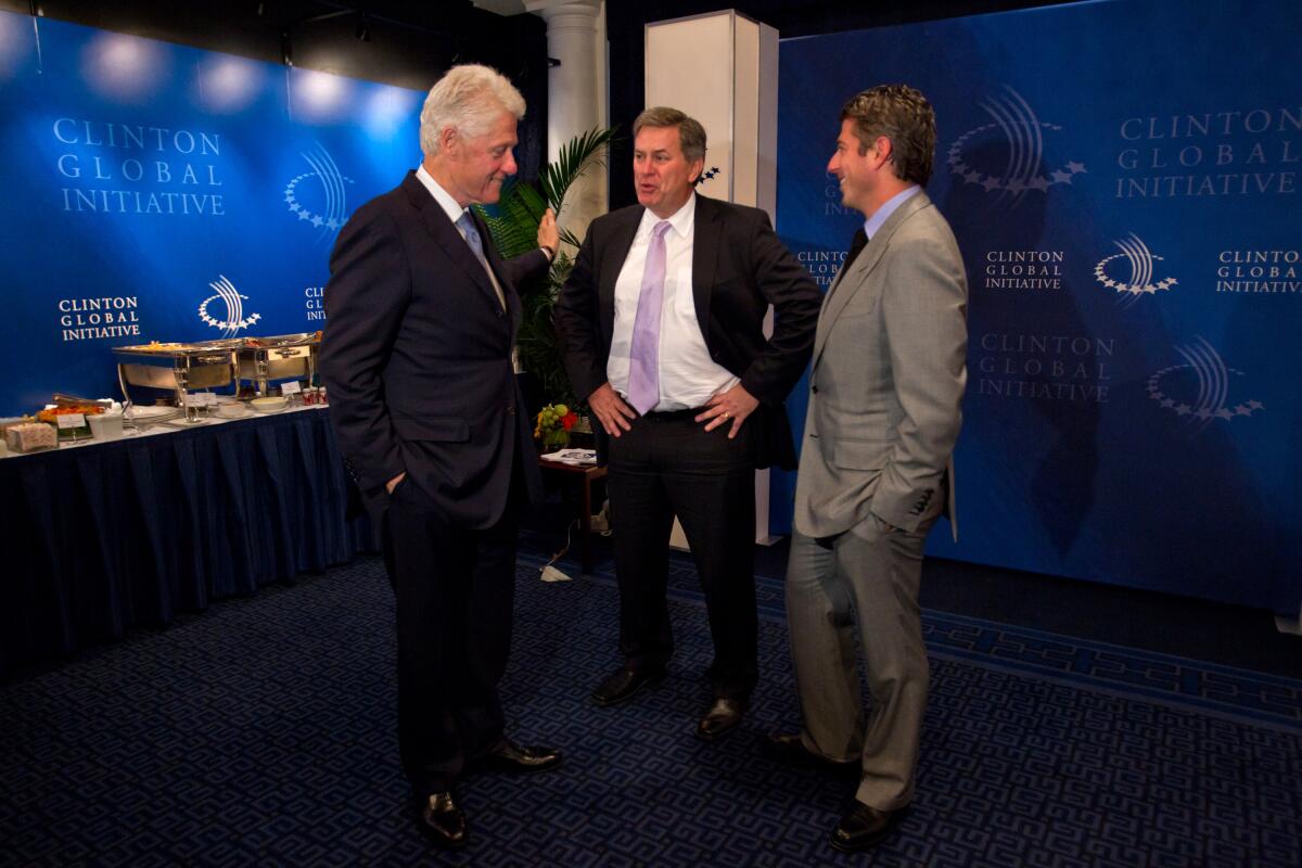From left, former U.S. President Bill Clinton, President and CEO of AEG Timothy J. Leiweke and Casey Wasserman talk.