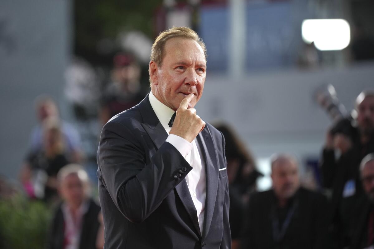 Kevin Spacey poses for photographers on the red carpet for the film 'Father Mother Sister Brother'