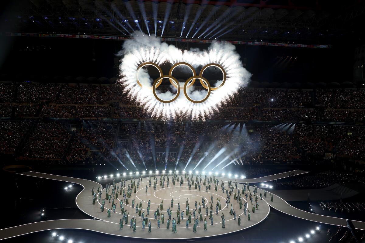 General view of performers and fireworks during the opening ceremony at the 2026 Winter Olympics