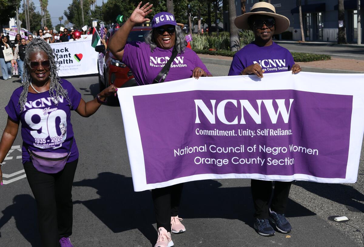 Women from the National Council of Negro Women of the Orange County take part in Orange County's Black History Parade.