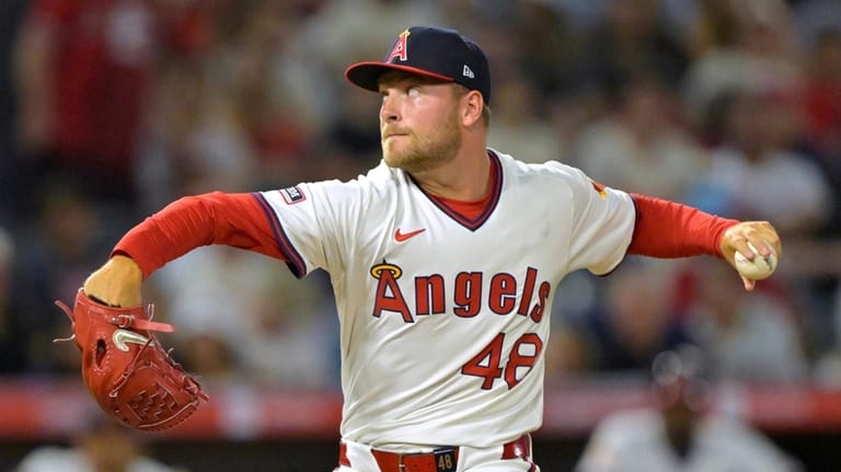 Los Angeles Angels relief pitcher Reid Detmers delivers to the...