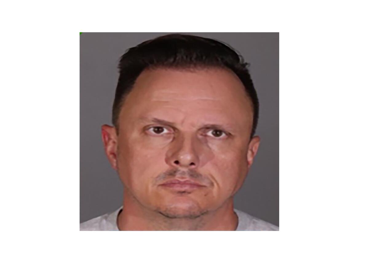 A mug shot of a man with dark hair