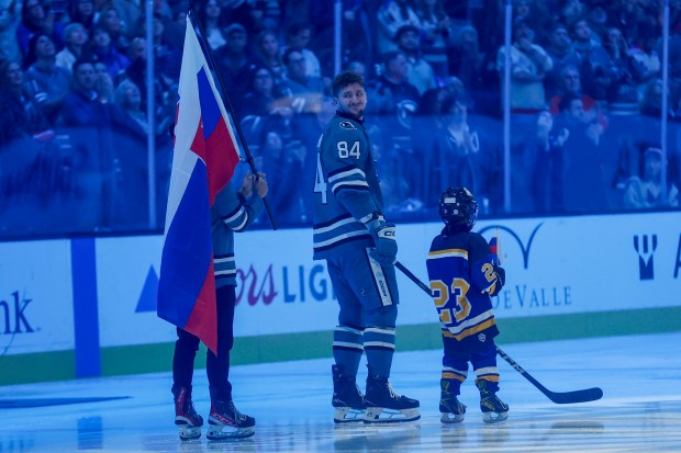 San Jose Sharks Pavol Regenda (84) smiles after being honored for being on the Slovakia roster for the 2026 Olympic Winter Games in Milan before a game against the New York Rangers at the SAP Center in San Jose, Calif., on Friday, Jan. 23, 2026. (Shae Hammond/Bay Area News Group)
