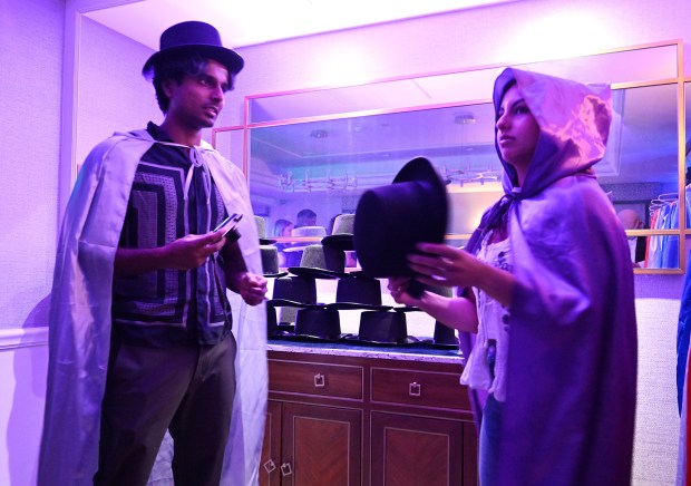 Diners pick out their magic attire before experiencing The Magic Table in San Francisco. (Chris Riley/Times-Herald)
