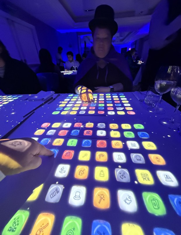 Diners experience their first interactive magic experience during The Magic Table in San Francisco. (Chris Riley/Times-Herald)