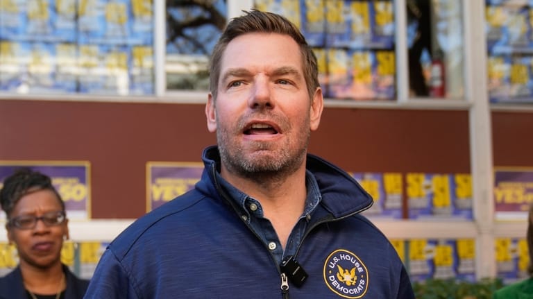 Rep. Eric Swalwell, D-Calif., speaks to reporters after a campaign...