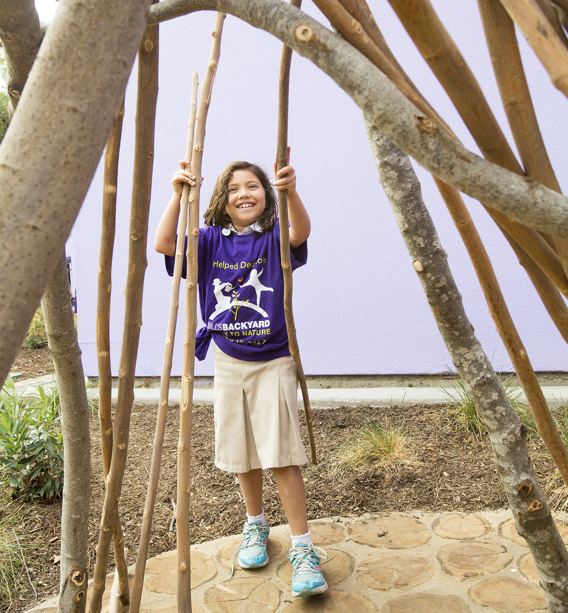 Third-grader Mia Pizarro builds a fort at the new Bill’s...