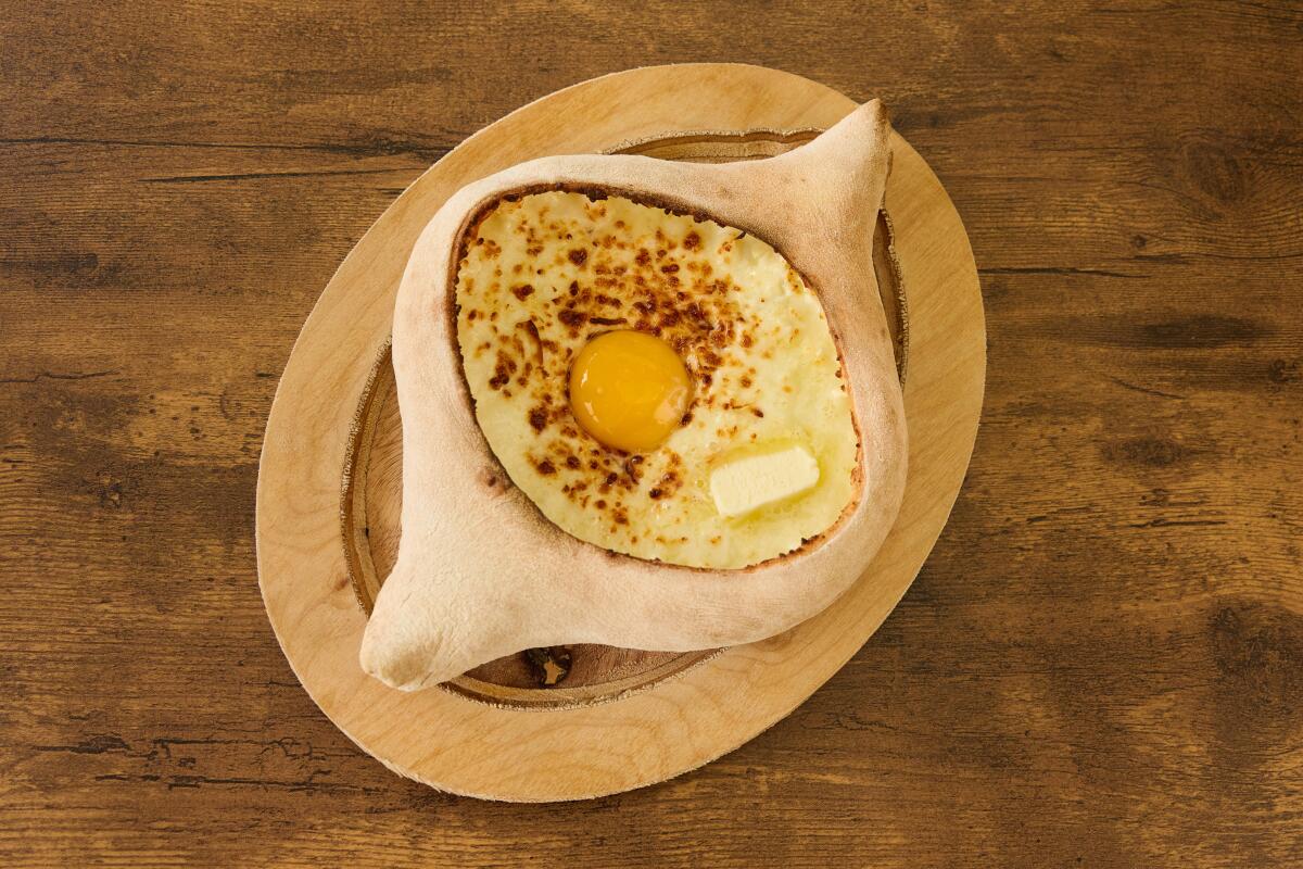 An open-faced, cheese-filled bread that’s shaped like a canoe