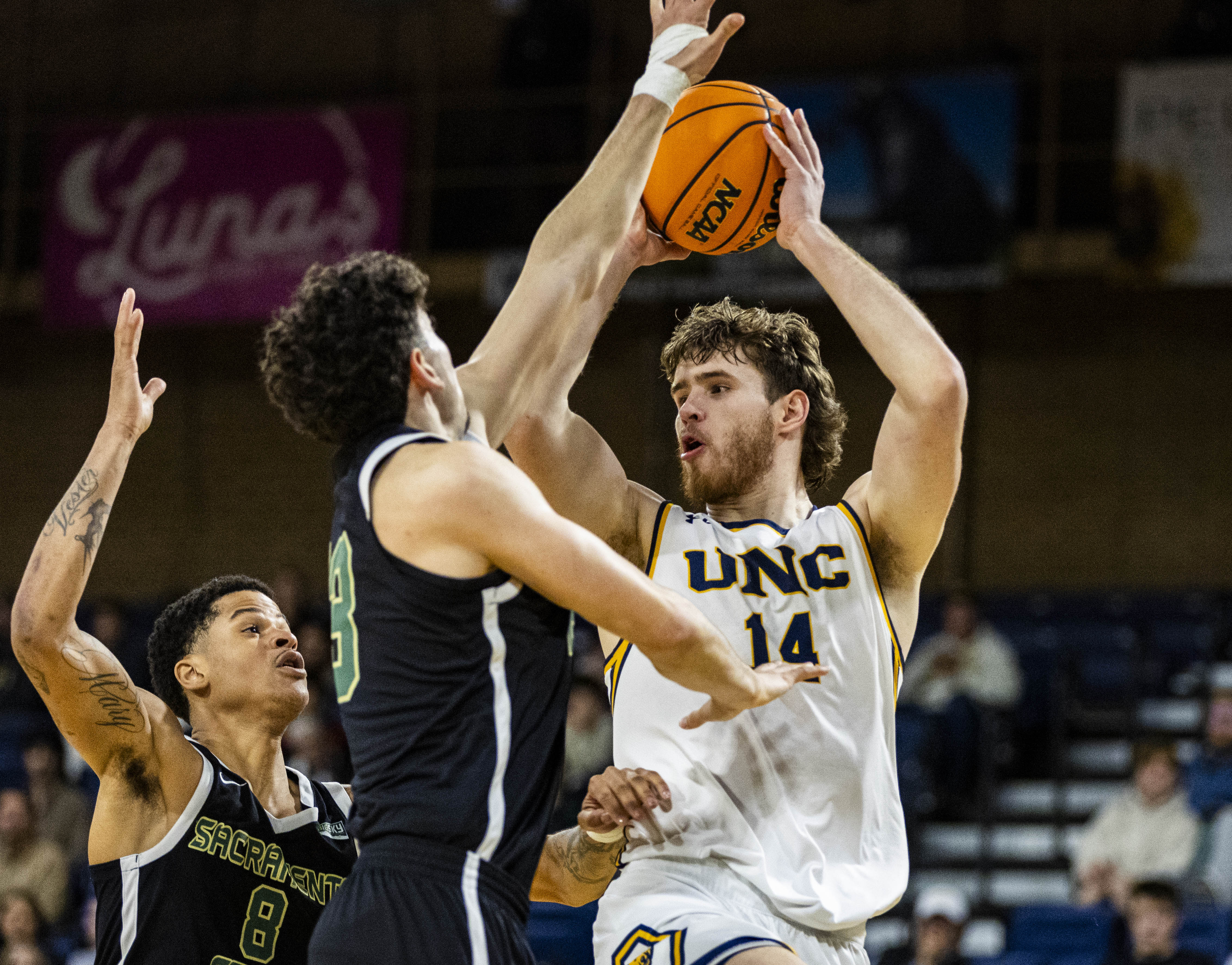 Northern Colorado Bears forward Brock Wisne (14) looks to pass...