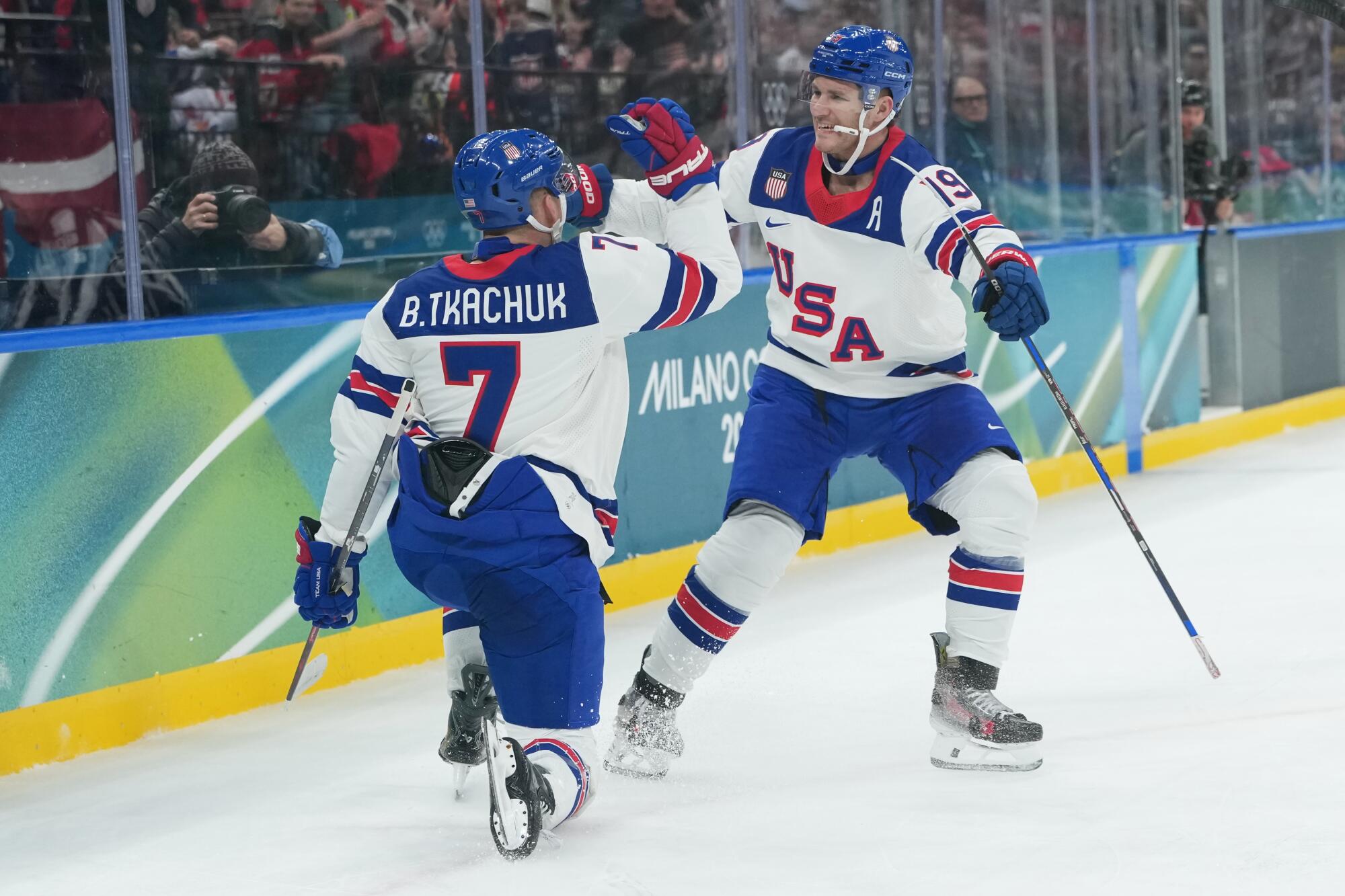 Brothers Brady Tkachuk, left, and Matthew Tkachuk after the U.S. scored the first goal of the game against Latvia.