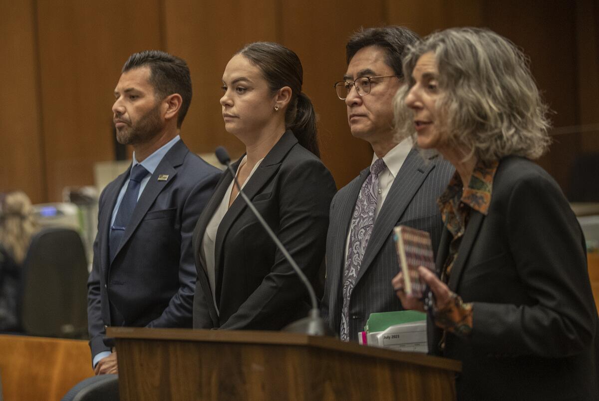 Ex-Whittier police officers Salvador Murillo, left, and Cynthia Lopez, are photographed during their arraignment.