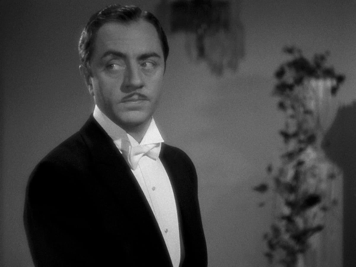 A man in a tuxedo looks askance.