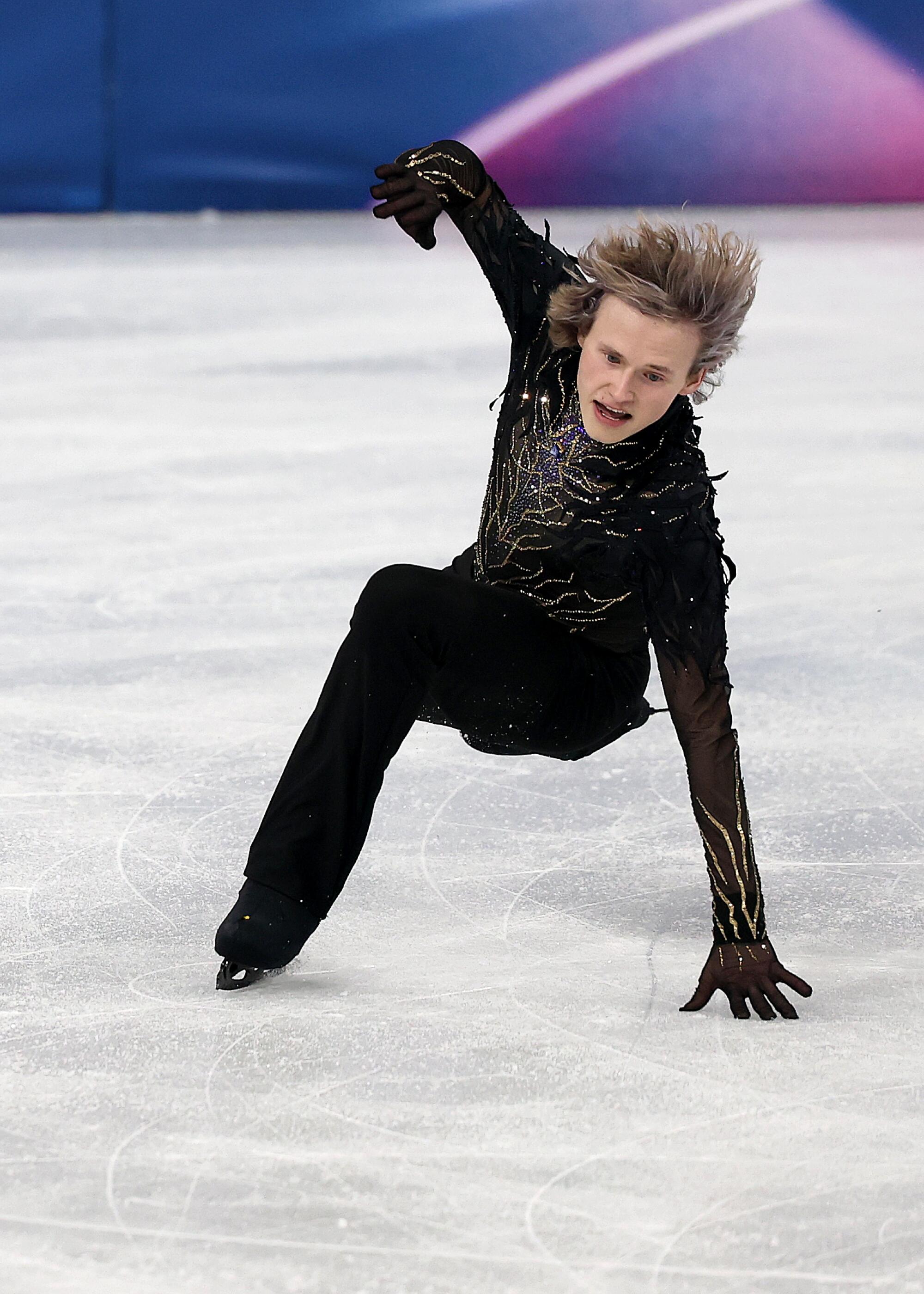 American Ilia Malinin falls while competing in the men's singles free skate at the Winter Olympics in Milan on Friday.