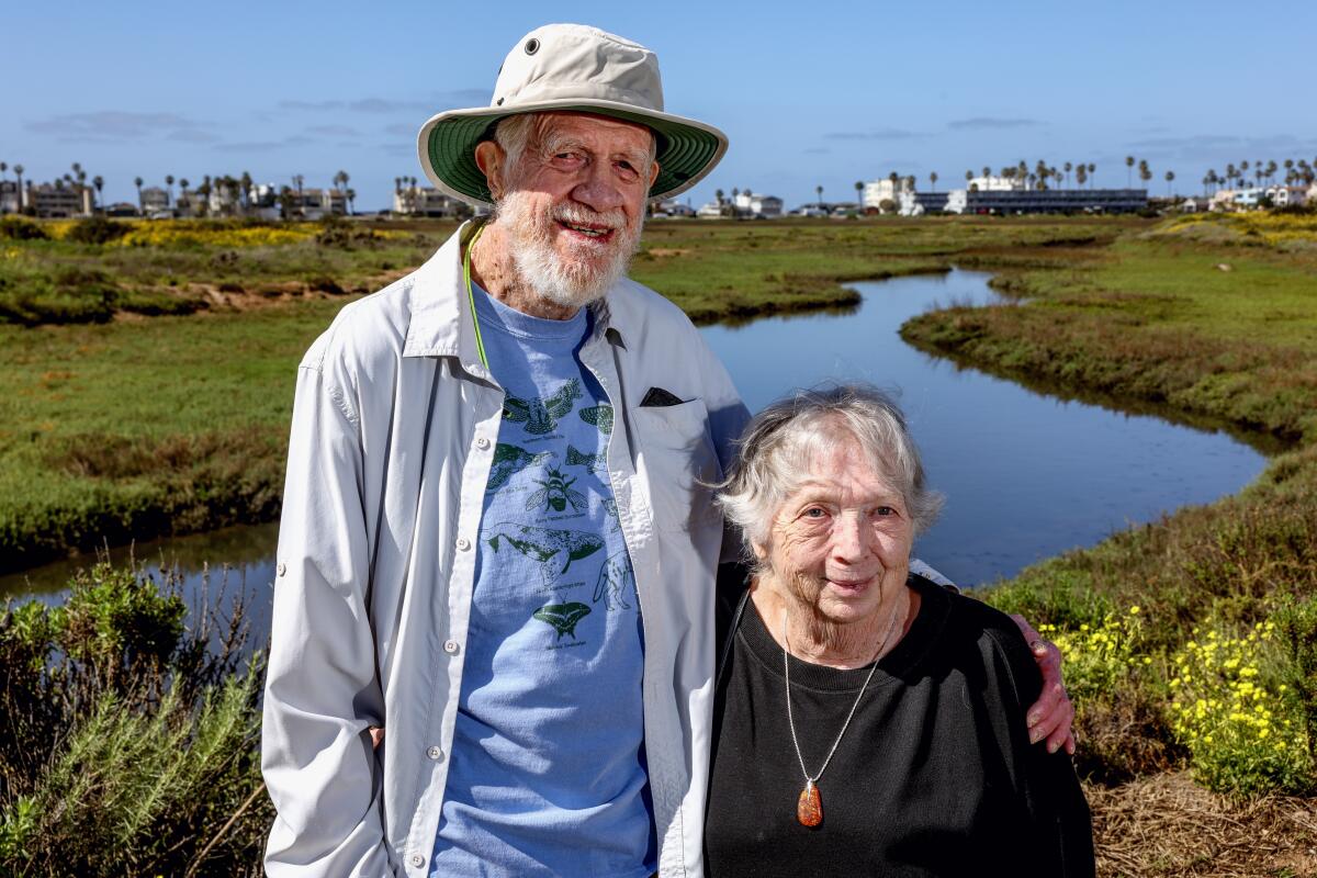 Costal conservationists Mike and Patricia McCoy on a trail named after them at the Tijuana Estuary Visitor Center.