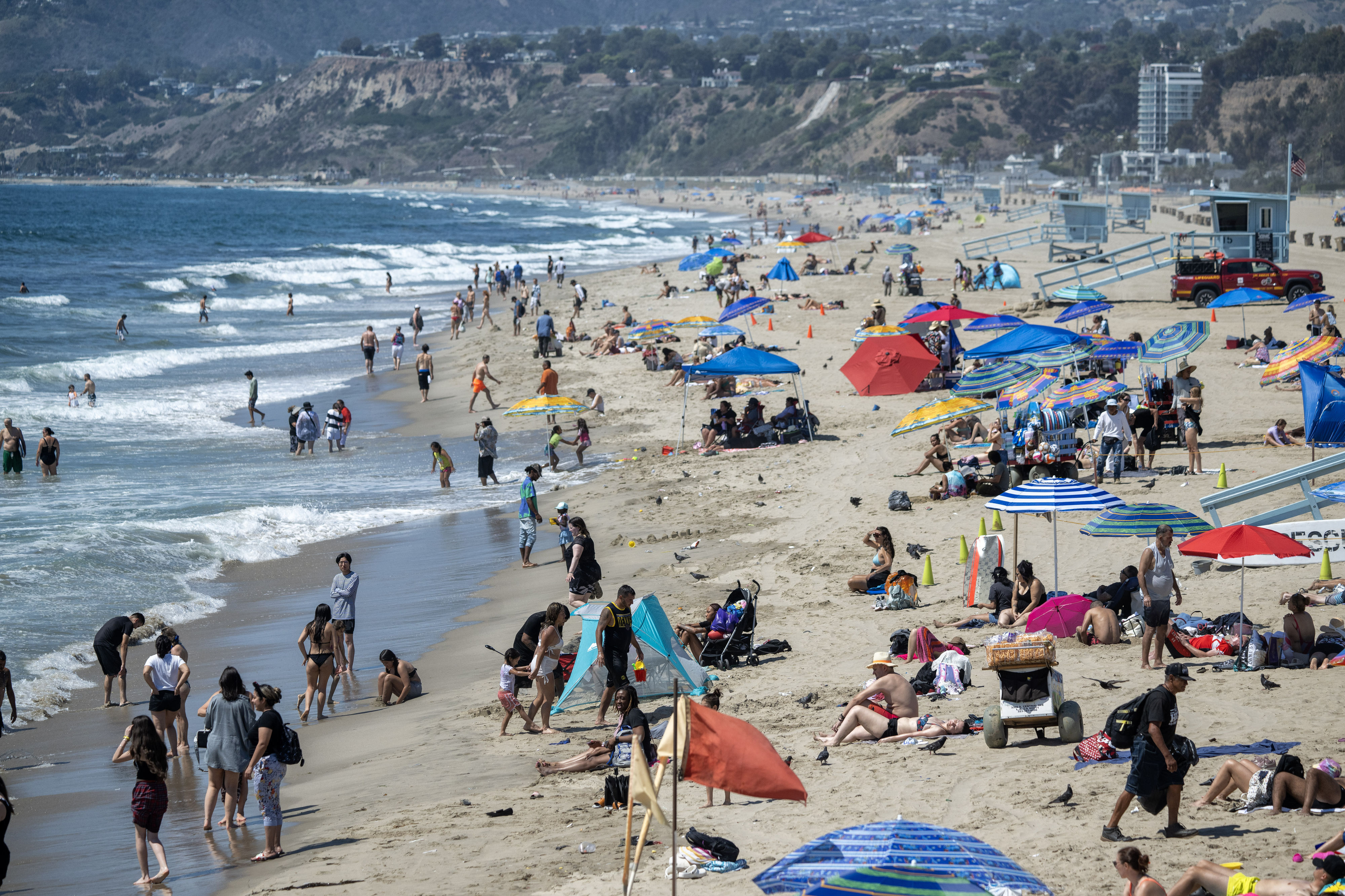 People beat the heat at Santa Monica Beach on Monday,...