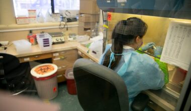 Meredith Reyes, a lab technician 1, labels. COVID-19 swab tests before processing at the Sonoma County Department of Public Health on June 8, 2021. Photo by Anne Wernikoff, CalMatters
